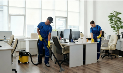 Cleaner Dallas commercial cleaning team vacuuming and sanitizing desks in modern office