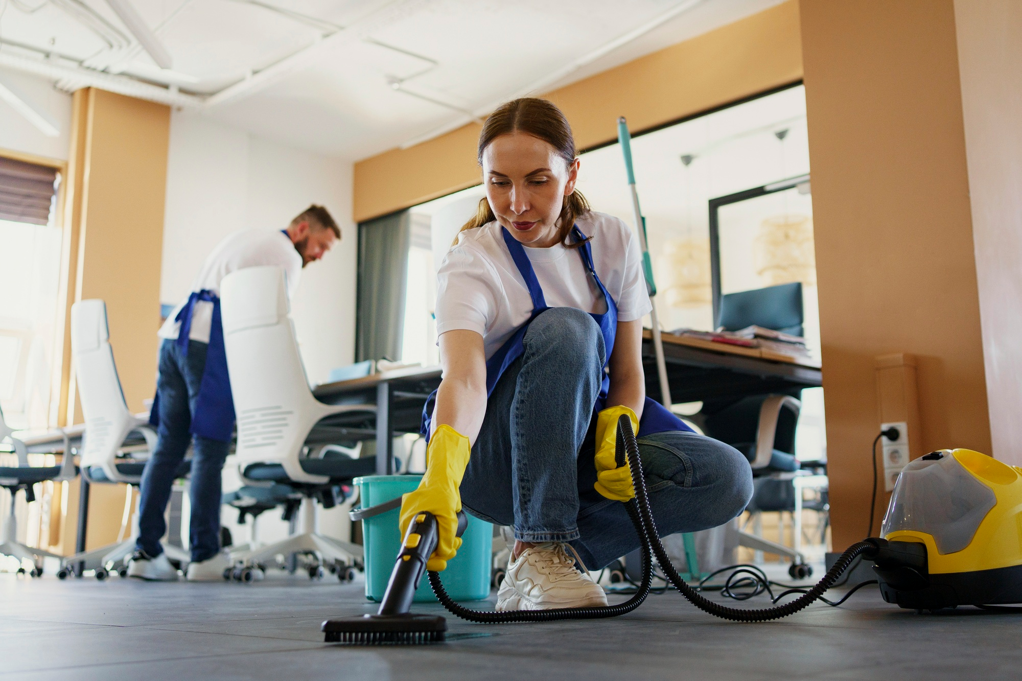 Cleaner Dallas team performing deep office cleaning with steam cleaner and floor sanitation