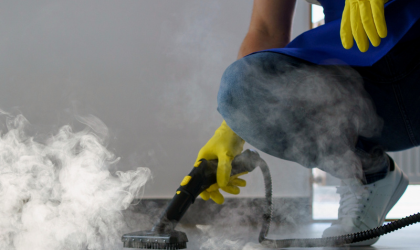 Professional deep cleaning in Dallas using high-pressure steam cleaner on floors.