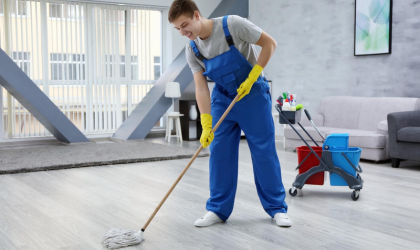 Professional cleaner mopping floors during move-in cleaning service in Dallas.